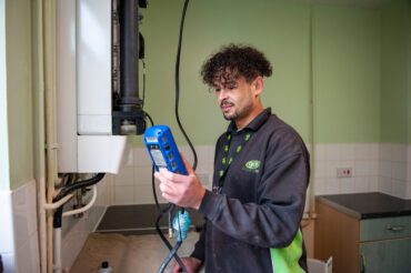 Gas engineer checking a boiler